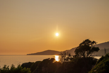 Sunset over the coast with trees and cliffs Corsica Sagone 12 June 2025