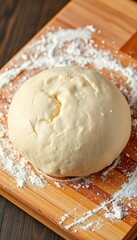 A ball of raw yeast dough on a wooden board, sprinkled with flour,  doughy,  uncooked
