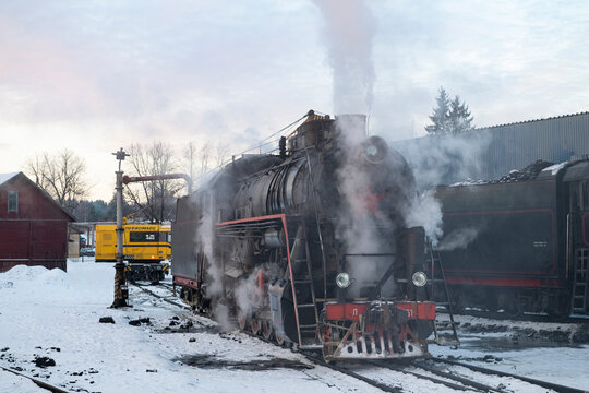 SORTAVALA, RUSSIA - FEBRUARY 20, 2025: The old Soviet steam locomotive of the "L" series refuels  with water on Sortavala station on a February morning