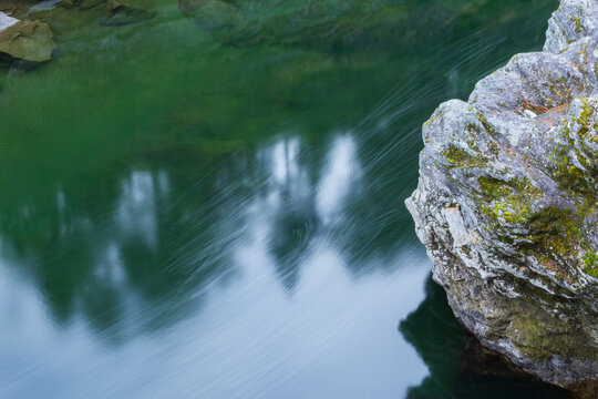A green river flowing through the mountains of Oppdal in Norway.