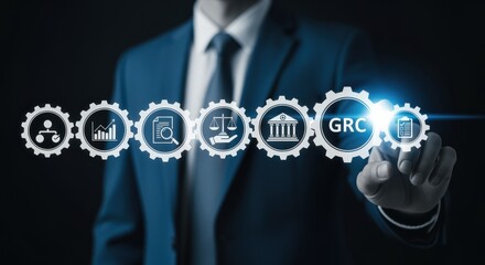 Governance Risk and Compliance: Businessman touching GRC icon for management process illustration, dark studio shot