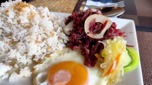 Classic Filipino Breakfast Corned Beef, Garlic Rice, and Fried Egg Cornsilog