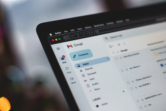 A laptop screen shows a Gmail message