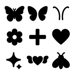 Silhouette icons of butterflies, hearts, and flowers in symmetrical patterns