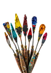 Obraz premium eleven professional palette knives caked with textured oil paint (crimson, yellow, teal) and worn wood handles, standing against a seamless transparent studio background, visual study of artistic