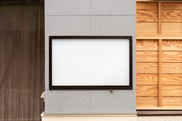 Large blank billboard on a street wall, banners with room to add your own text