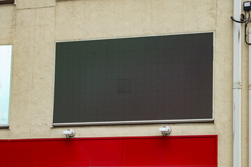 Large blank billboard on a street wall, banners with room to add your own text