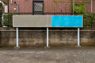 Large blank billboard on a street wall, banners with room to add your own text