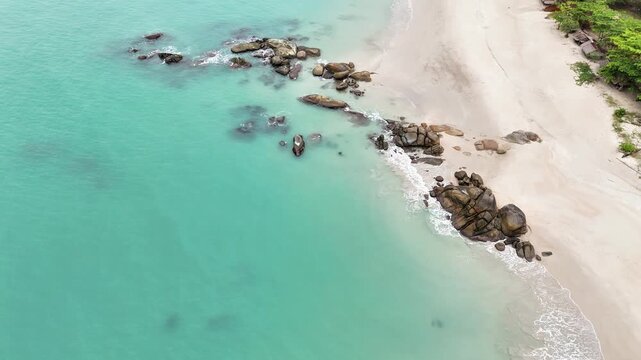 Aerial View of Pristine White Sand Beach and Clear Blue Sea in Tropical Paradise