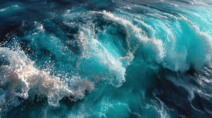 Turbulent, turquoise ocean wave cresting and breaking, white foam