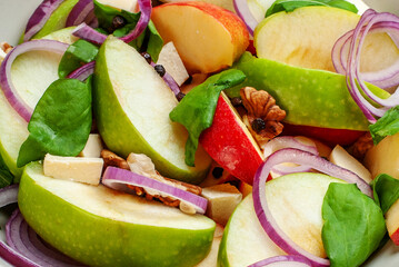 Healthy Fresh Fruit Salad with Sliced Green Apples Red Onions and Walnuts
