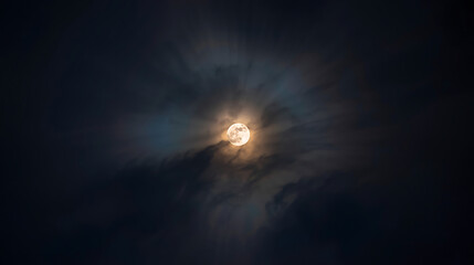Lunar glow through clouds