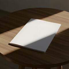Blank White Book Mockup on Wooden Table with Natural Sunlight.