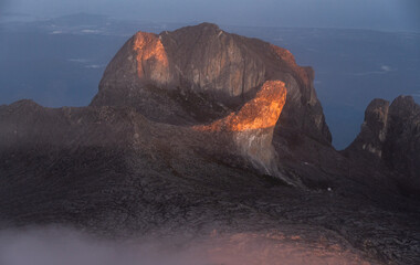Spectacular view of the Alexandria's peak (3,994 m) lit by sunlight during morning on Mt Kinabalu the highest mountains on Borneo island.