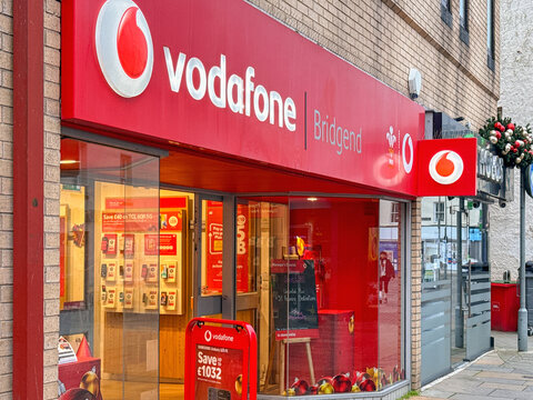 Bridgend, Wales, UK - 14 December 2025: Front exterior view of the Vodafone mobile phones shop in Bridgend town centre.