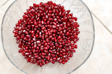 Top View Fresh Pomegranate Seeds in Glass Bowl