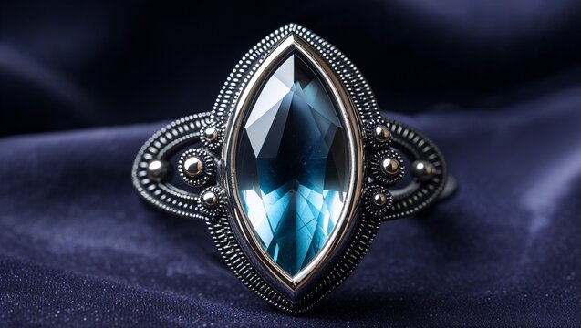 Marquise cat eye tourmaline watchful pin in blackened silver sharp chatoyancy spotlight on midnight velvet
