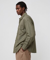 smiling filipino guy on oversized shirt fit model pose on white background