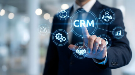 Businessman touching CRM interface on futuristic virtual screen,concept of customer relationship management,sales data analysis,digital technology network,corporate global connection