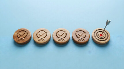 Wooden stamps with approved check marks and one target bullseye with arrow,symbolizing quality assurance excellence,reaching business goals,marketing strategy and performance success.