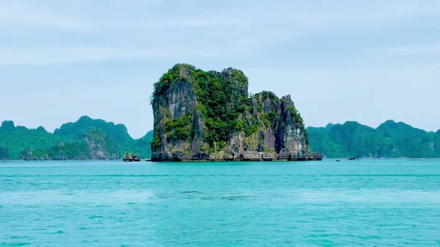 View from a cruise admiring the fascinating islands at Bai Tu Long Bay. An indescribable sense of freedom as you look out into the distance, capturing clusters of islands big and small