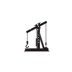 Black silhouette of an oil pump jack on a white background industry