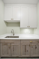 White kitchen with a sink and cabinets