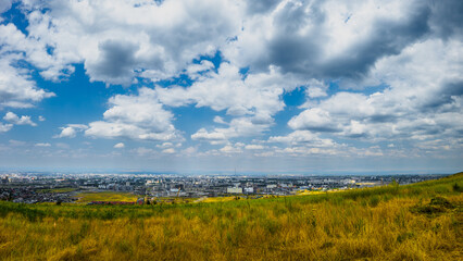 Vast Bishkek cityscape showcases stunning buildings against a backdrop of rolling hills. Bright...