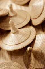 A lot of toy wooden spinning tops