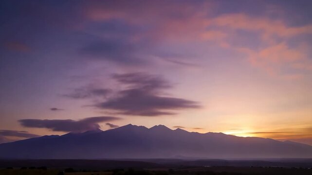 Composite sequence of a mountain range silhouette during a dramatic sunset. Time lapse concept showing the changing colors of the sky from dusk to twilight over a peak