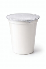 White plastic yogurt cup with silver foil lid on white background container food