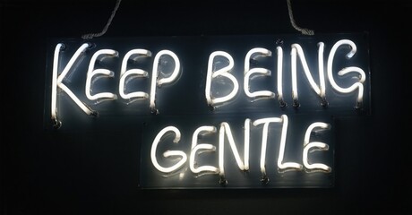 Obraz premium Neon sign displays message Keep Being Gentle. Dark background emphasizes bright lettering. Simple, modern aesthetic. Positive affirmation.