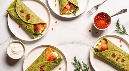 Tasty spinach crepes with salmon, red caviar, sour cream and dill on white marble table, flat lay. 