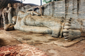 Side view of the Reclining and Standing Buddhas at the Gal Vihara or Rock Monastery,Uttararama, built by the great Sinhalese King Parakrambahu I, 12th century CE at Polonnaruwa, Sri Lanka