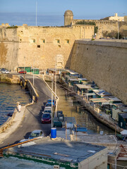 Boathouses and fishing shacks along Valletta city wall
