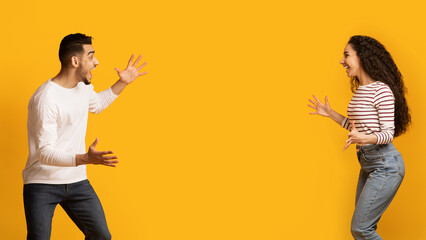 Big Luck. Overjoyed Middle Eastern Couple Raising Hands And Exclaiming With Excitement, Emotional...