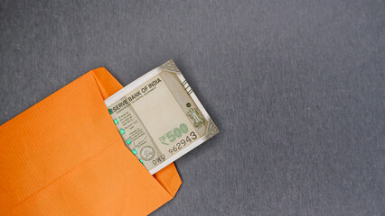 Indian 500 Rupee Note Partially Visible Inside an Envelope.