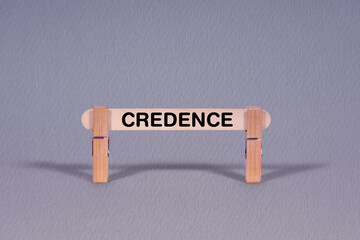Credence symbol. Single Wooden stick restrained by Clothespins, beautiful Gray Background. Business and Credence concept with copy space