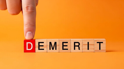A hand flipping a block to change the word demerit to merit on a bright orange background