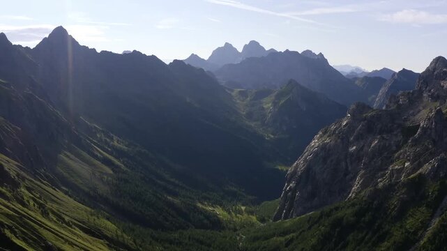 Cinematic Aerial View of Dep Alpine Valley and JaggedMountain Peaks