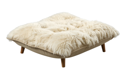 Square, cushioned footstool with plush, light-colored fur top and short wooden legs