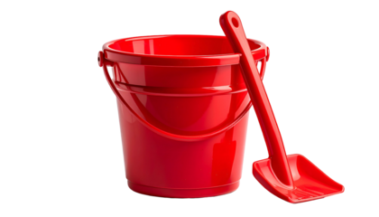 A shiny red toy bucket with a matching spade, isolated on a transparent background