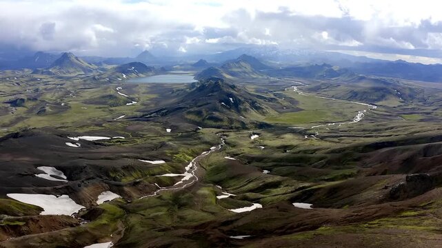Vast Aerial View of Icelanic Highlands with Winding iver and Peaks