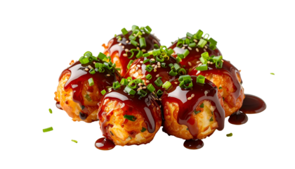 Close-up of Japanese street food, golden-brown spheres drizzled with savory sauce and garnish