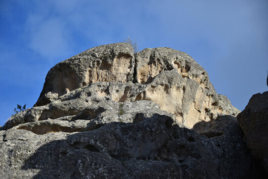 Tovtry picturesque limestone cliffs steep slopes rocks yellow gray brown with rusty spots forest trees autumn tourism nature flora