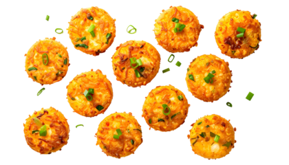 Overhead view of a dozen golden-brown, round, savory fried food items with green garnish