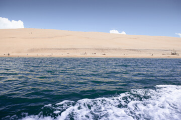 Seascape and beachgoers in the Southwest of France