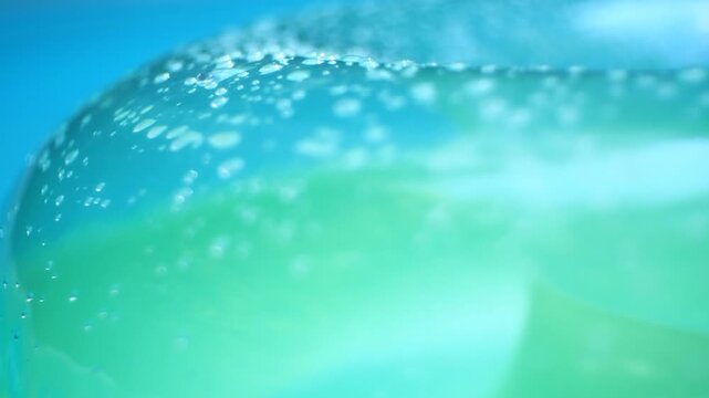 Blue and Green Pool Float on Swimming Pool Water Background