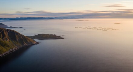 Misty dawn aerial drone view of norwegian coastline
