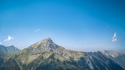 Fototapeta premium Namloser Wetterspitzer (2553 m), a popular day-hike peak in the Tyrolean Lechtal Alps, featuring rugged alpine terrain and panoramic mountain views.